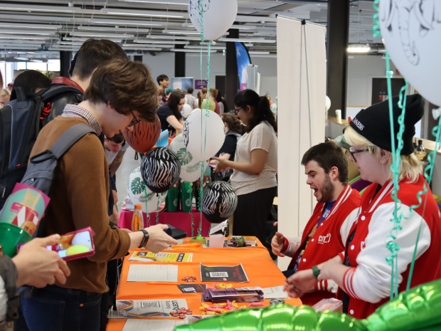 Photo from Freshers Week 2022 - Students engaging with the Students' Association stall.