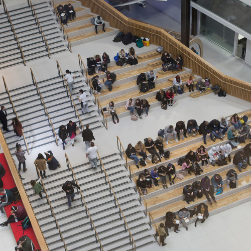 Birdseye view overlooking the College mezzanine where students are gathered.
